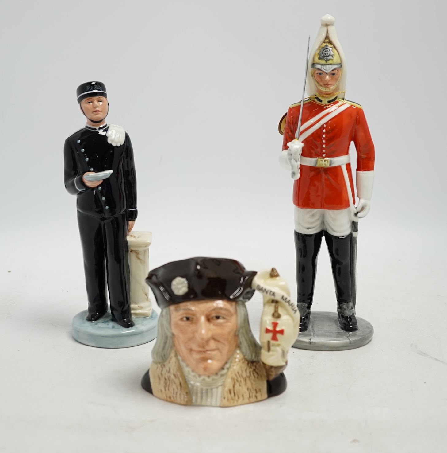 Six Royal Doulton figures including Bunny’s Bedtime, The Guardsman and The Lifeguard, together with a Christopher Columbus Toby jug, all boxed, Guardsman 25cm high. Condition - fair to good